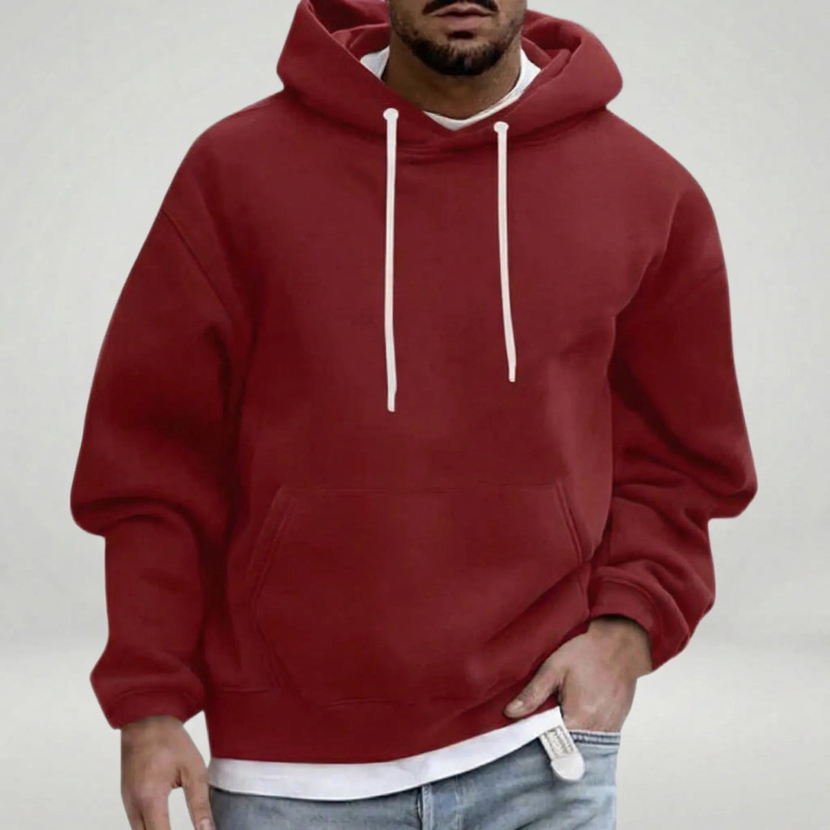 Man wearing dark red hoodie with white drawstrings, layered white shirt underneath | Chaps London