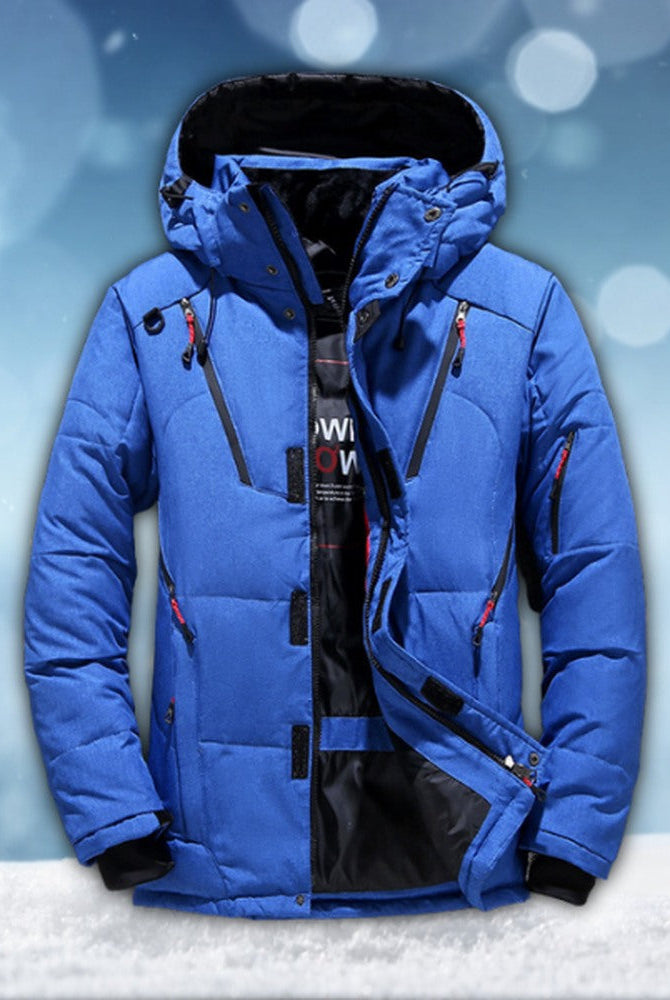 Blue padded winter jacket with hood, unzipped, displayed flat against snowy background | Chaps London
