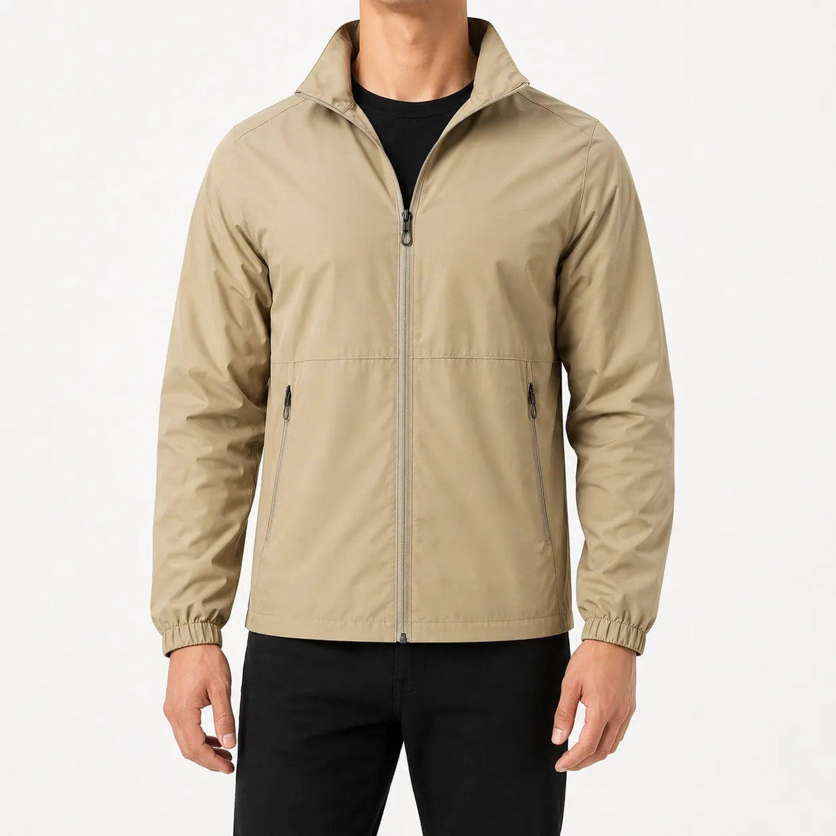 Man wearing beige zip-up rain jacket with black pants, standing | Chaps London