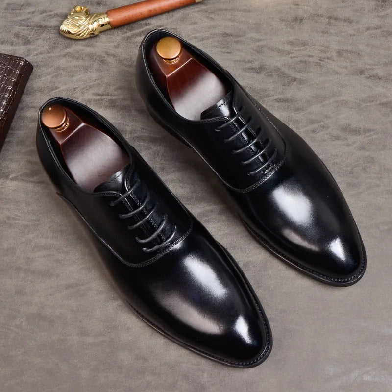 Black Oxford dress shoes with laces, shown flat with shoe trees inserted | Chaps London