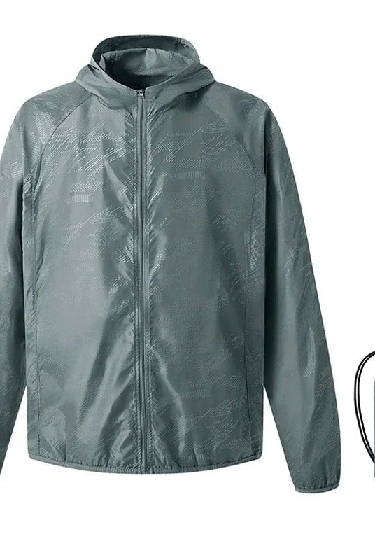 Gray hooded windbreaker jacket flat-laid with matching packable storage pouch | Chaps London
