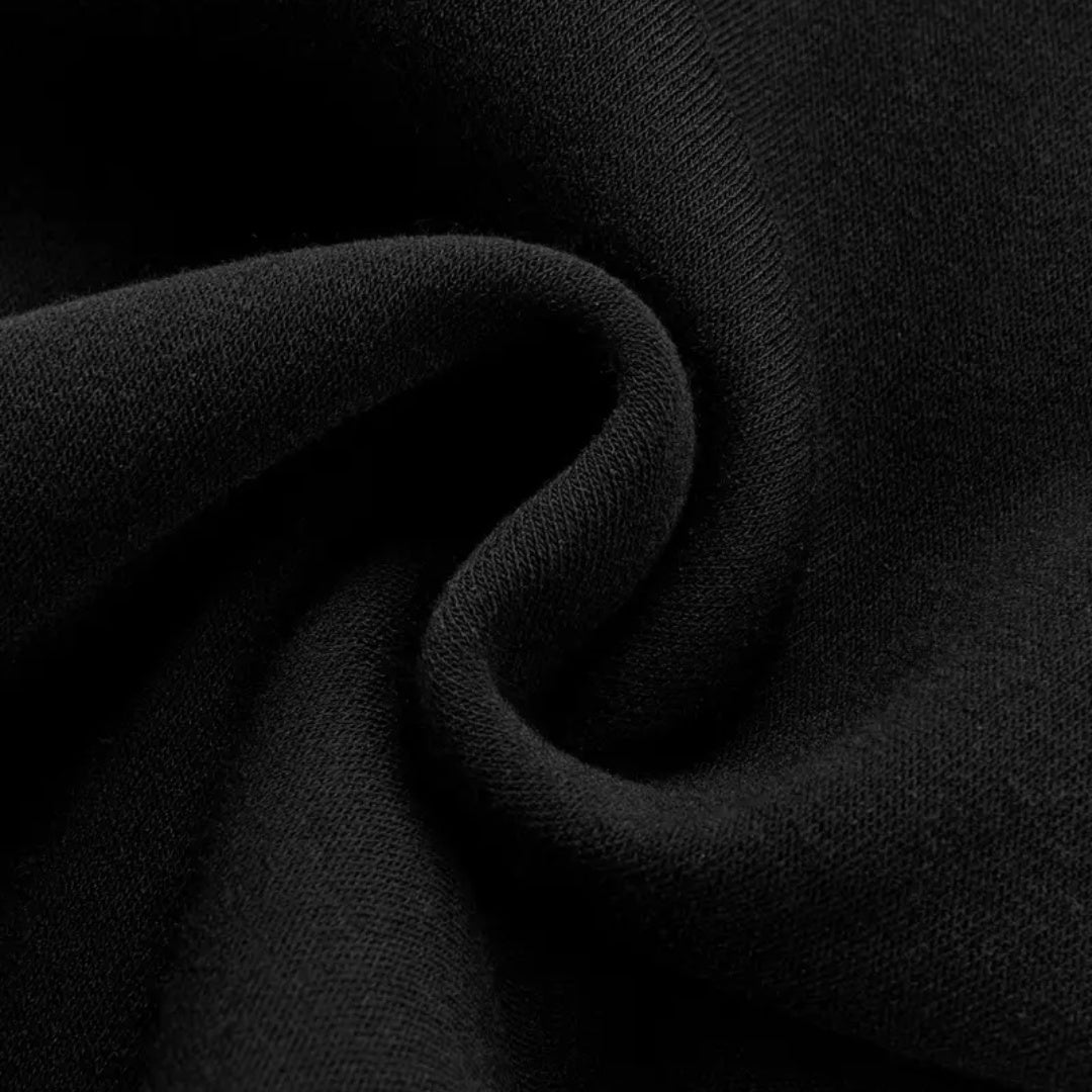 Black fabric with swirled twist detail, close-up texture, no model shown | Chaps London