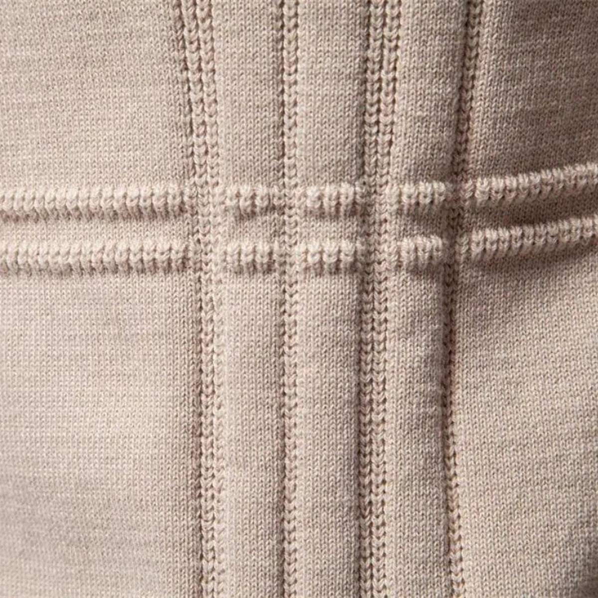 Beige knitted fabric close-up with raised ribbed lines forming grid pattern | Chaps London
