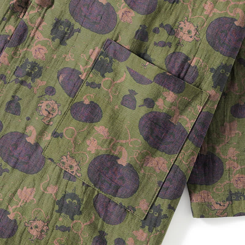 Green kimono fabric with purple pumpkins and monster print, close-up pocket detail | Chaps London