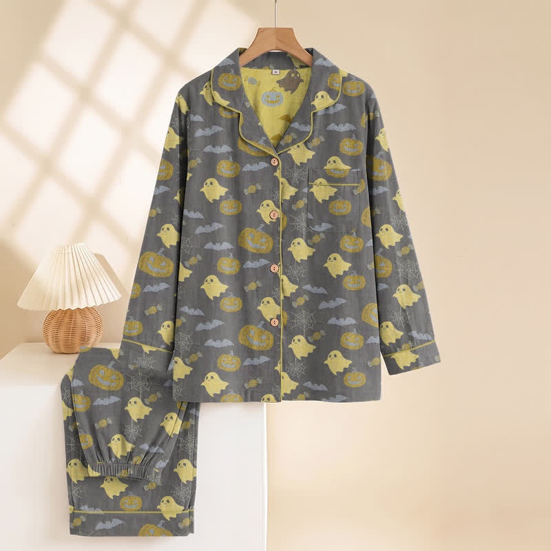 Gray pyjama set with yellow ghost pumpkin print, hanging on hanger | Chaps London