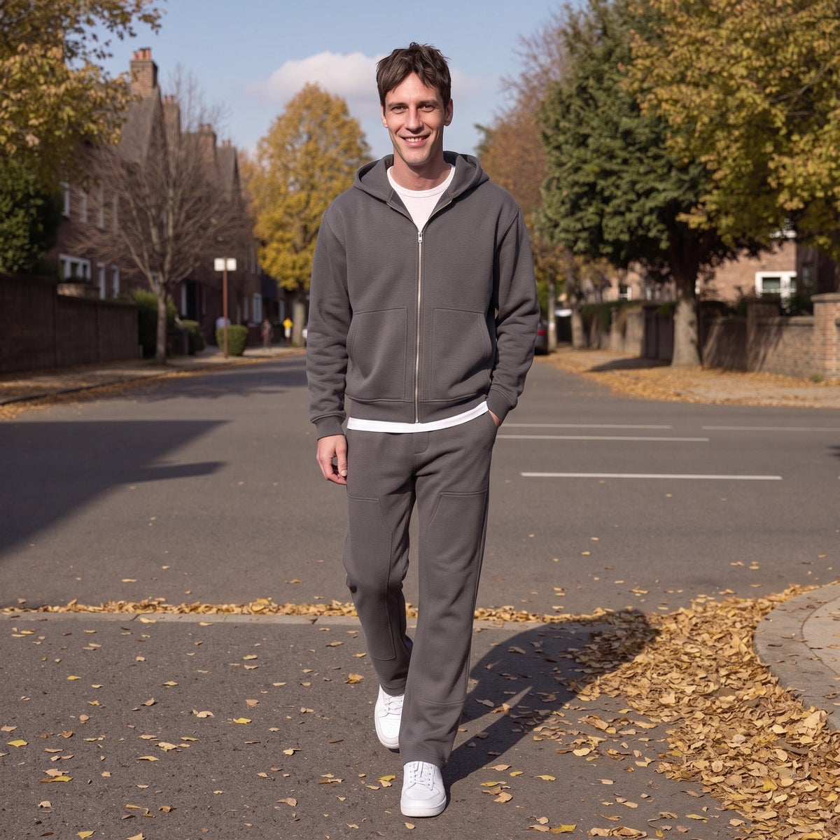 Man wearing dark grey zip hoodie and joggers, walking outdoors on street | Chaps London