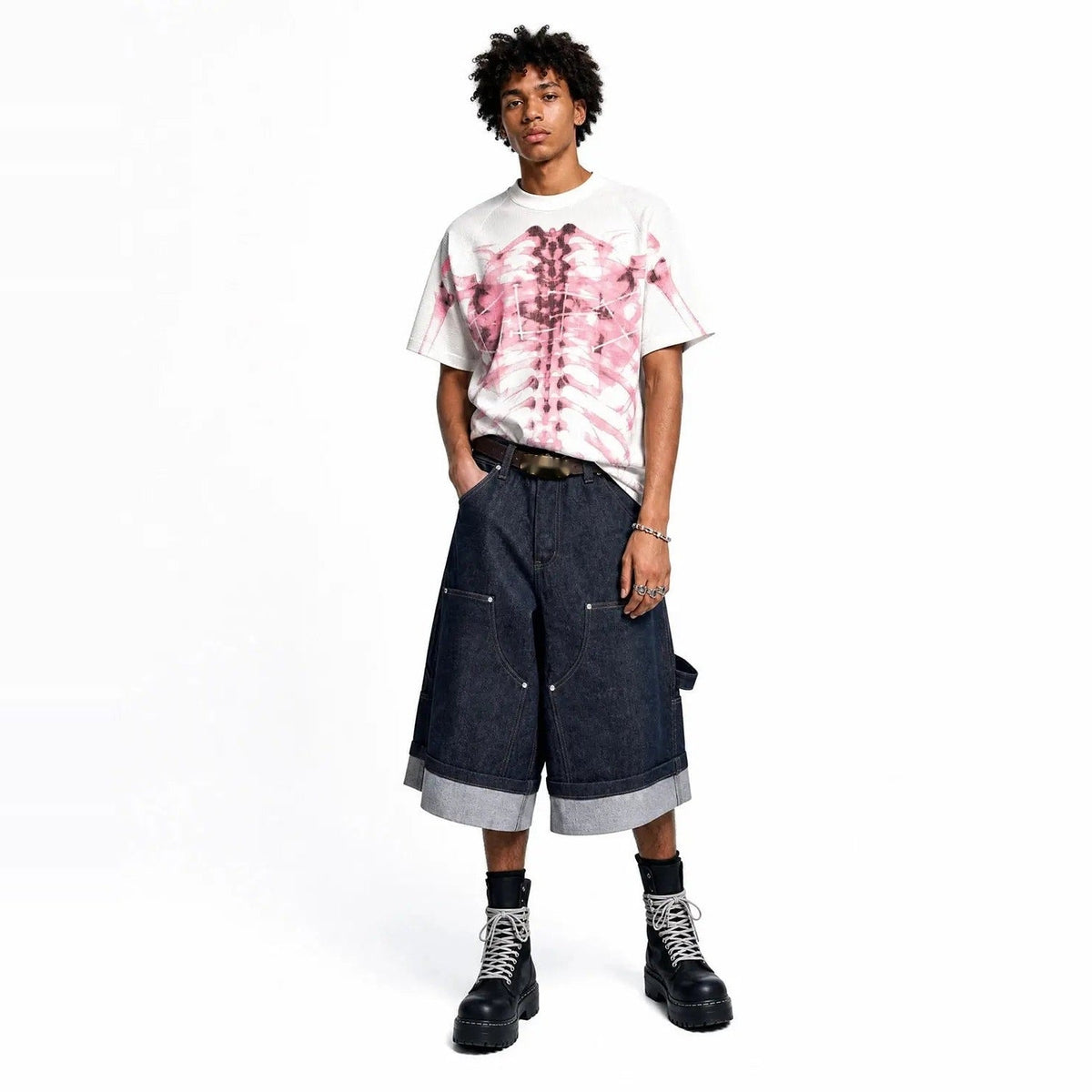 White oversized T-shirt with pink skeleton print, worn by male model | Chaps London