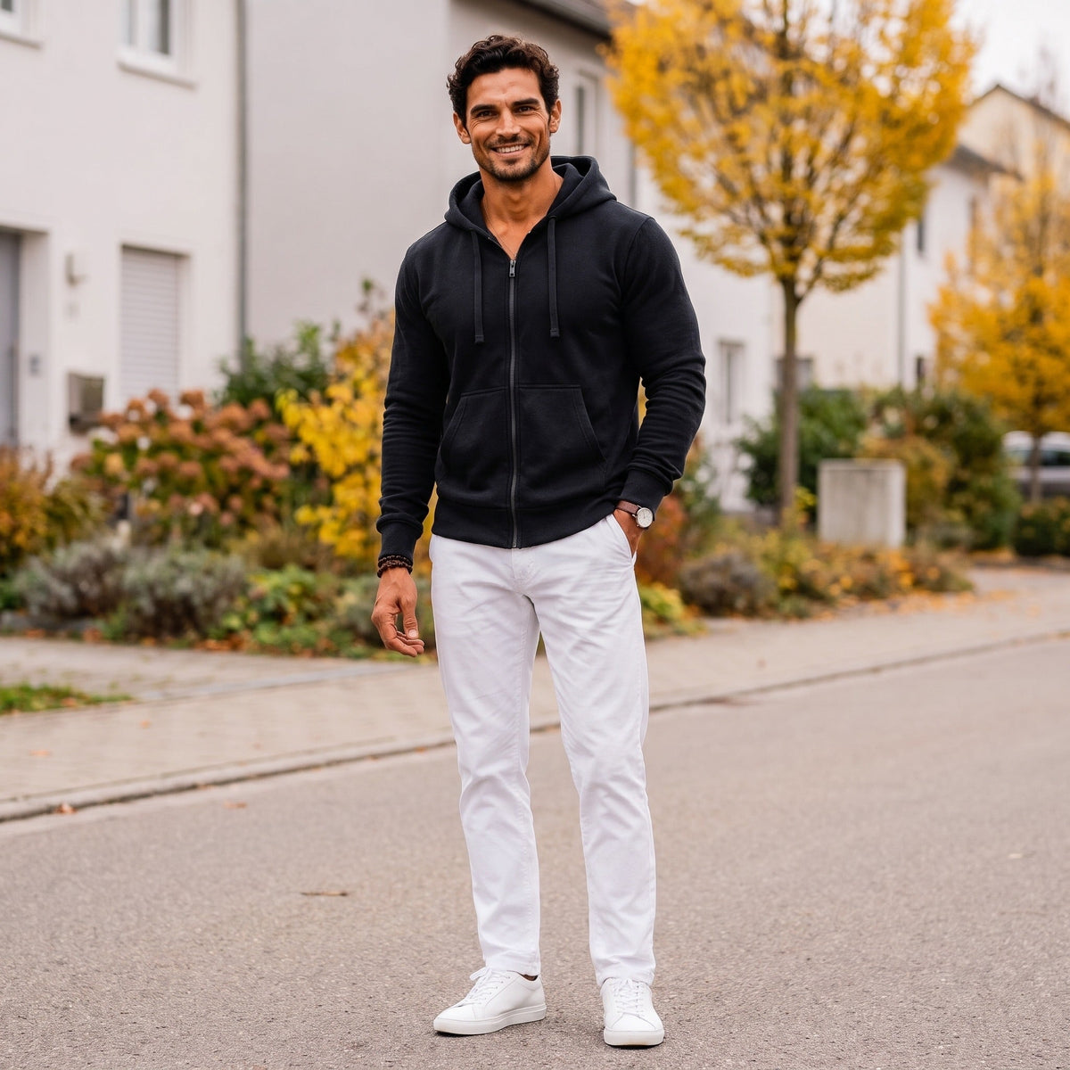 Man wearing black zip hoodie with white pants on street | Chaps London