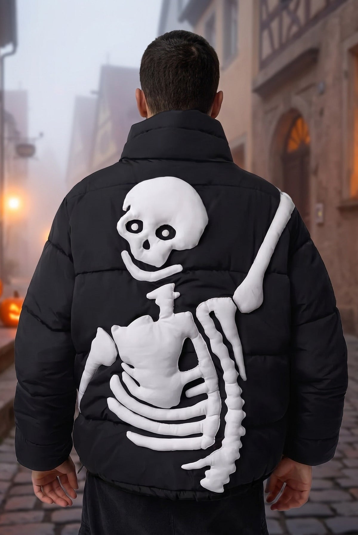 Black puffer jacket with raised white skeleton design, worn by man outdoors | Chaps London