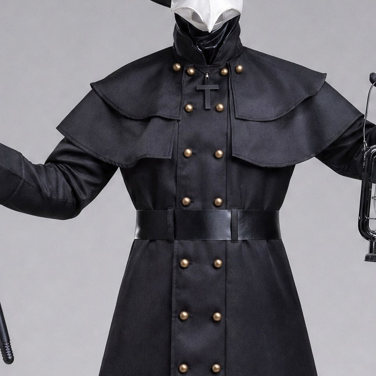 Black belted military-style coat with cape layers and cross detail, worn by mannequin | Chaps London