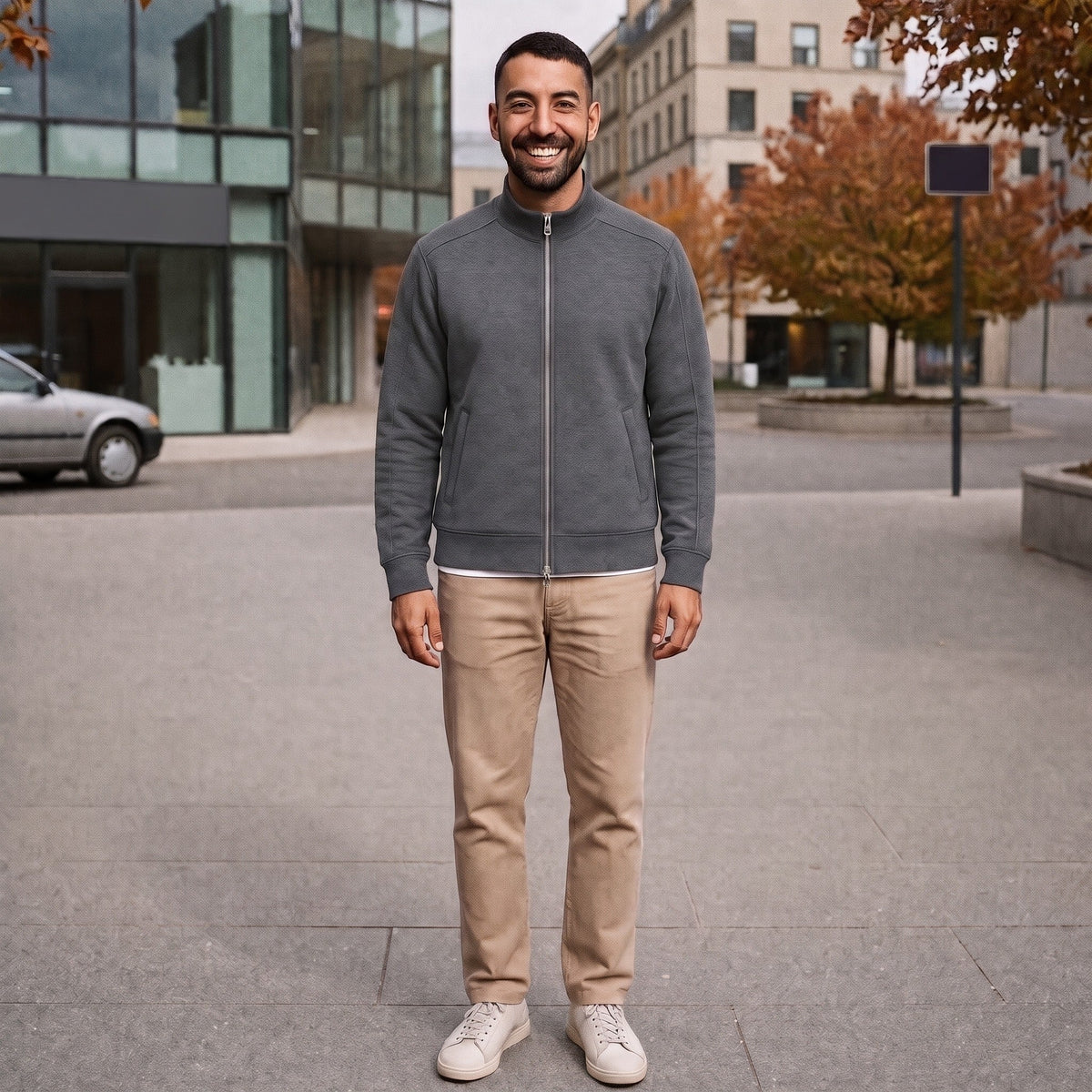 Man wearing grey zip-up stand collar sweat jacket with beige pants outdoors | Chaps London