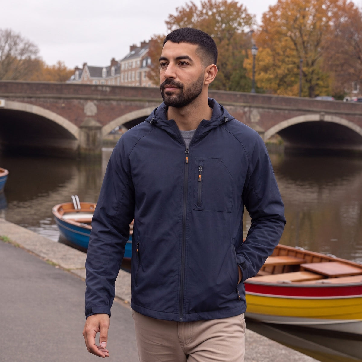 Man wearing the navy hooded rain jacket