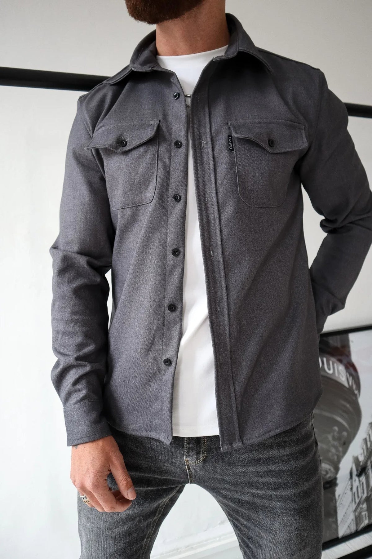 Men's dark grey button-up overshirt with chest pockets