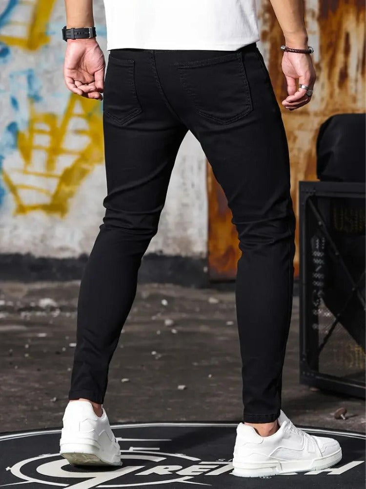 Men's black skinny jeans, back view