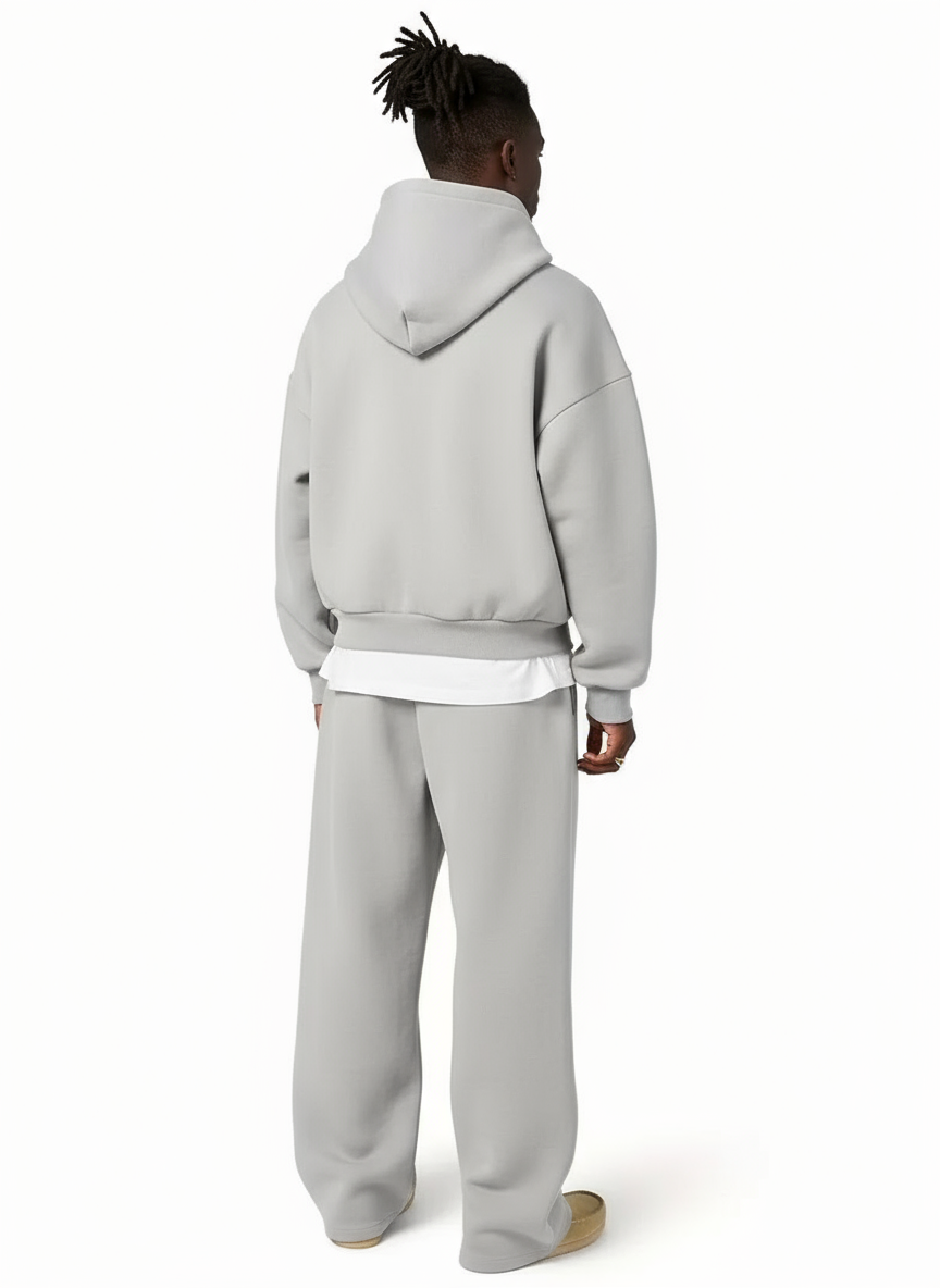 Man wearing gray oversized hoodie and matching straight-leg jogger sweatpants outdoors | Chaps London