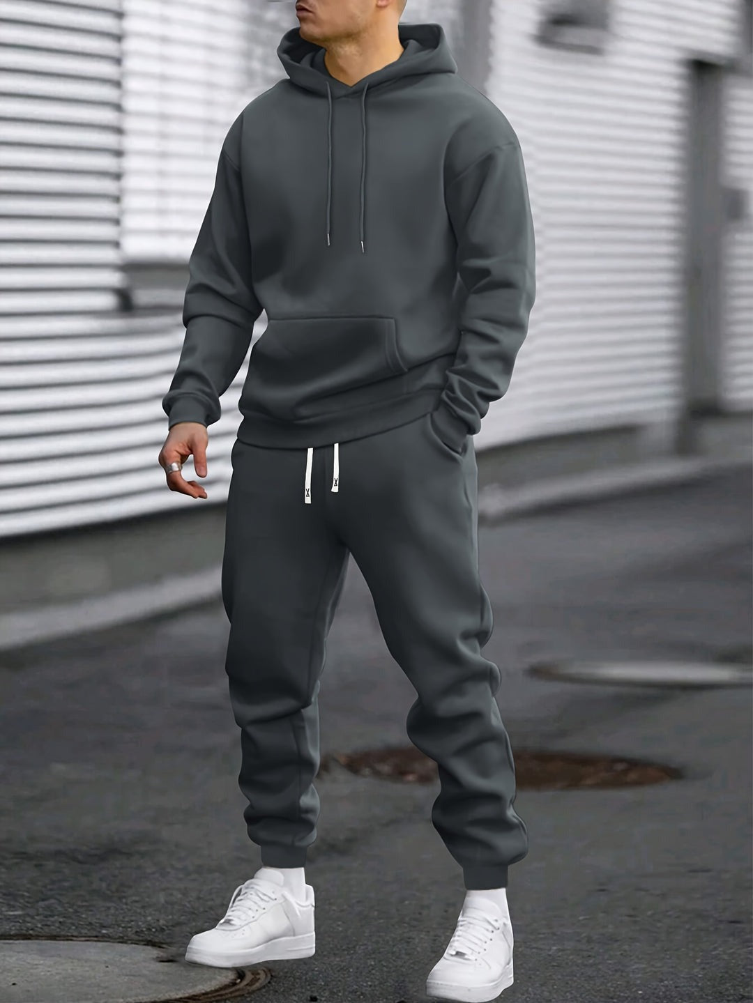Man in a dark grey hoodie and joggers tracksuit set | Chaps London