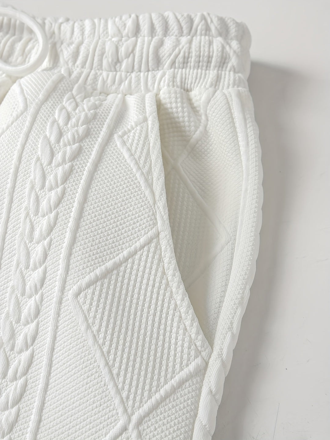 Close-up of the joggers' waistband, drawcord and side pocket with the cable pattern | Chaps London