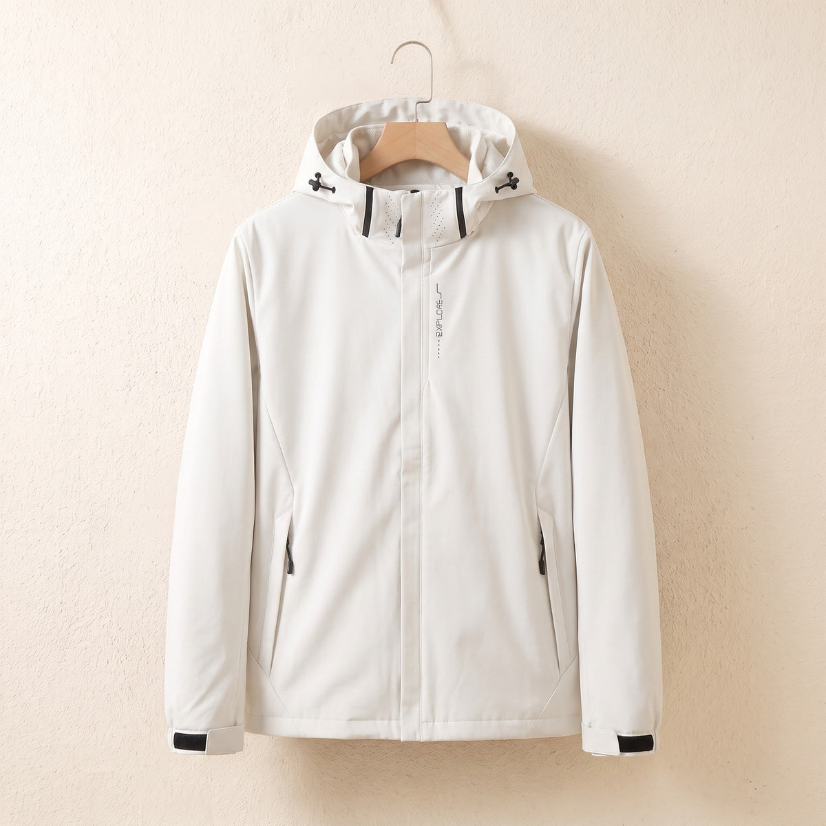 White waterproof jacket with hood on a hanger