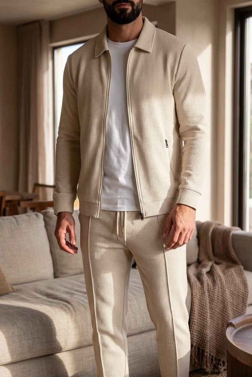 Man wearing beige waffle-texture zip jacket and matching trousers indoors | Chaps London