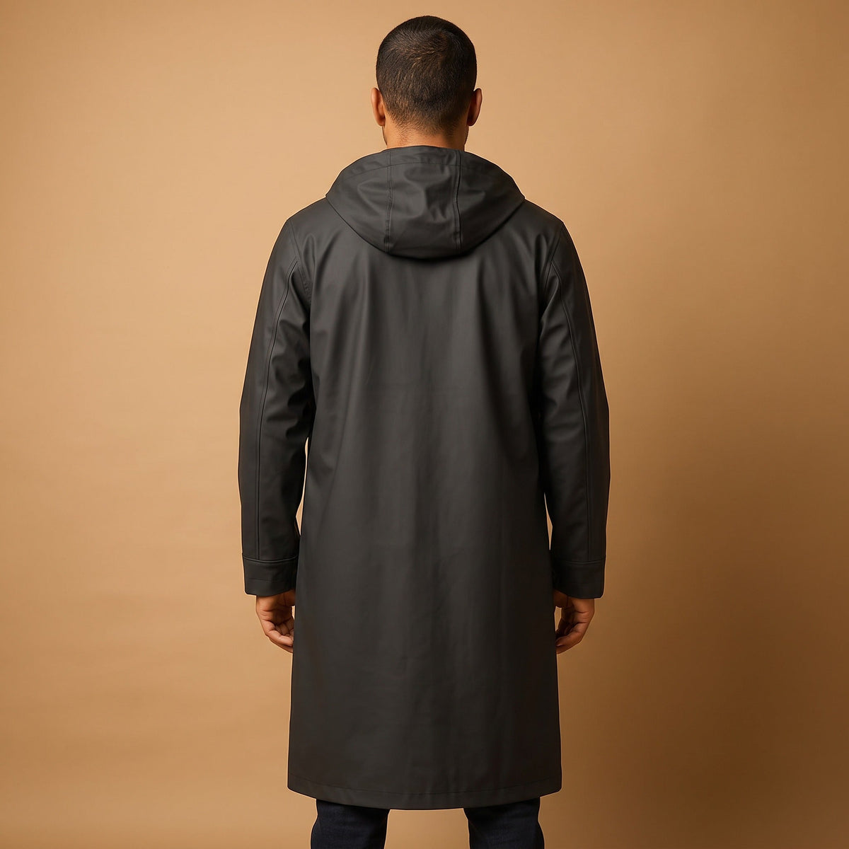 Man wearing black long hooded raincoat, viewed from behind | Chaps London