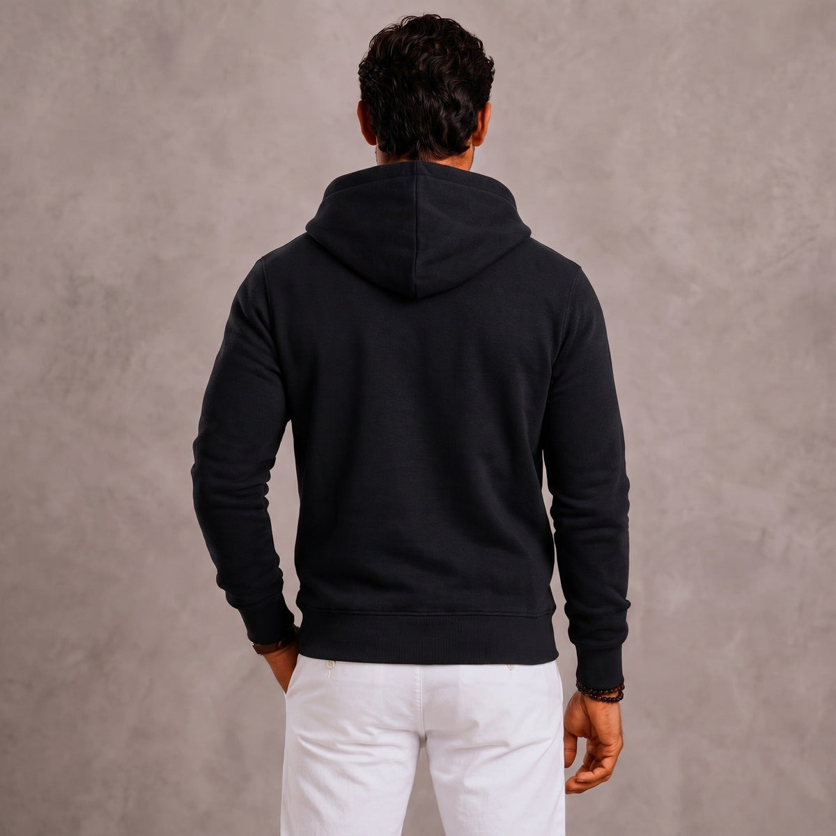 Man wearing black full-zip hoodie with hood, viewed from behind | Chaps London