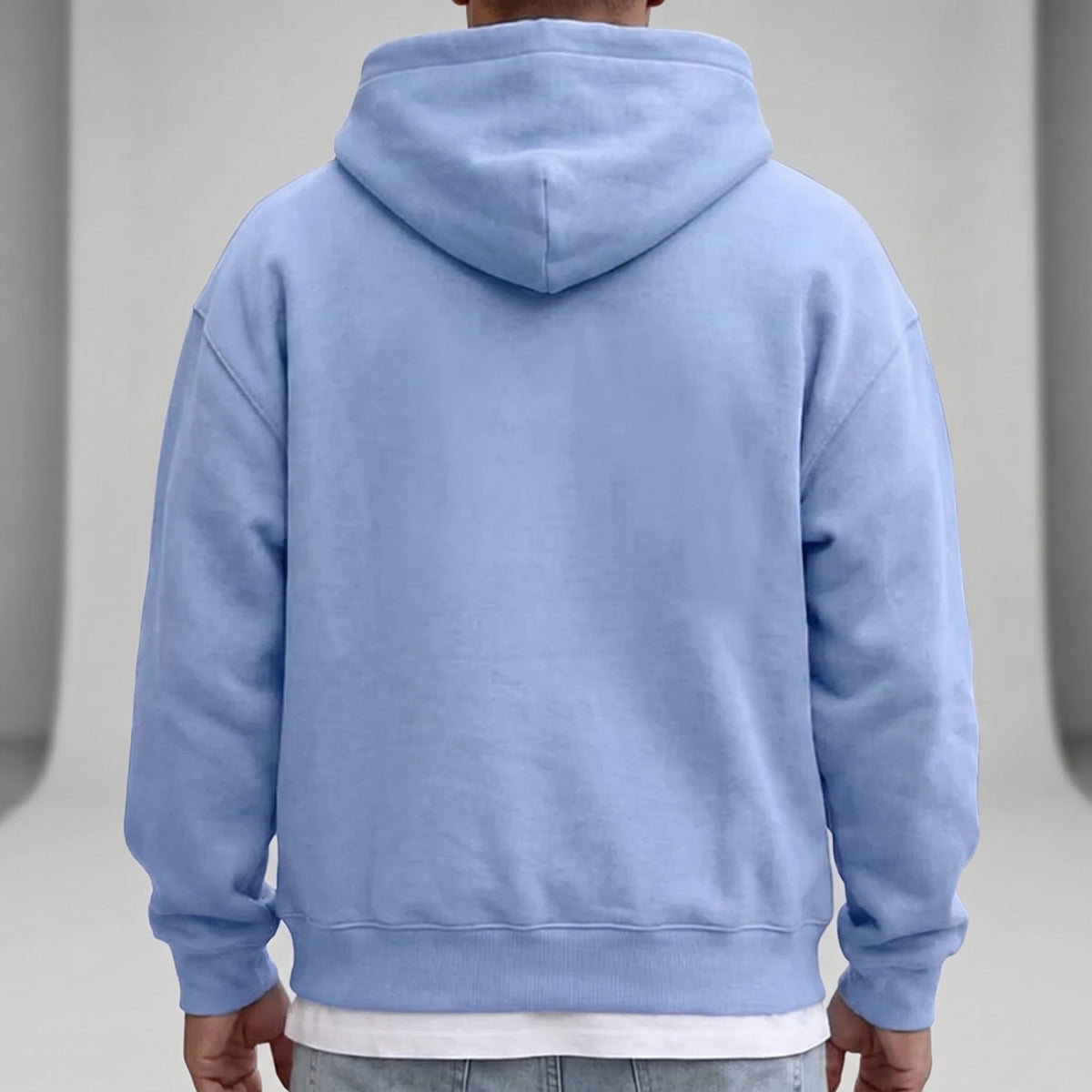 Light blue hoodie worn by man, shown from behind, hood up | Chaps London