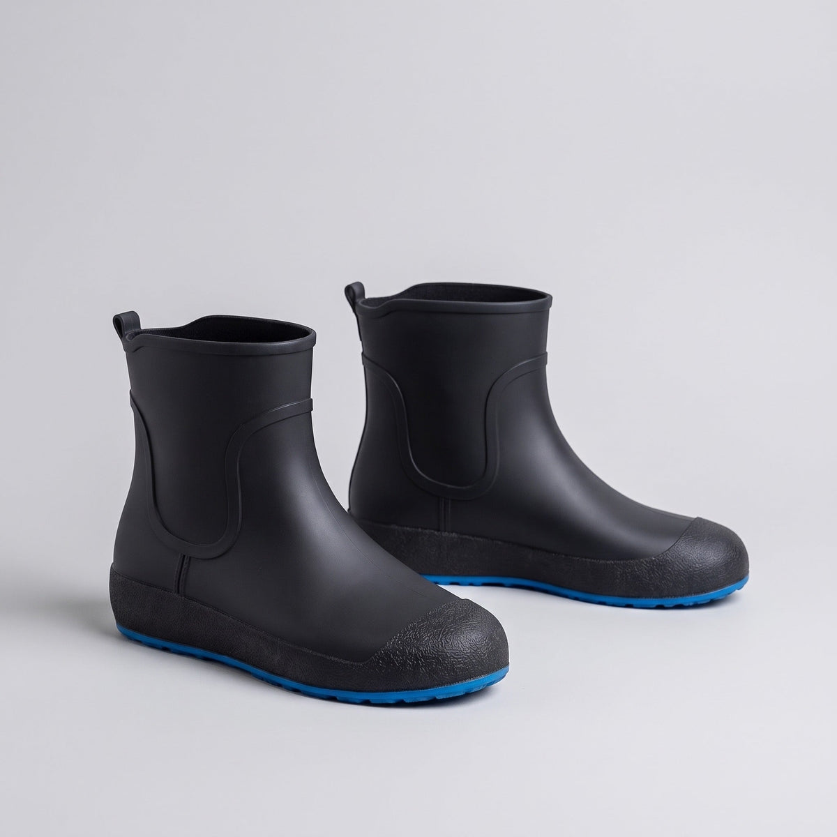 Black ankle wellies with blue soles, shown as a pair, no mannequin | Chaps London
