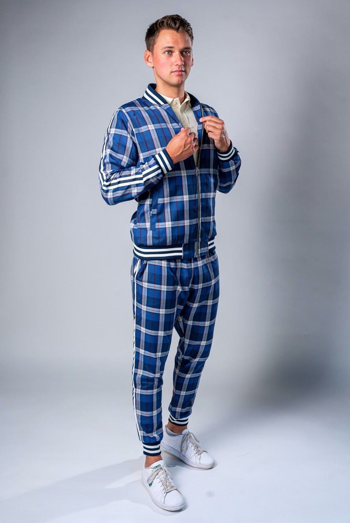 Man wearing blue plaid zip track jacket and matching jogger pants | Chaps London