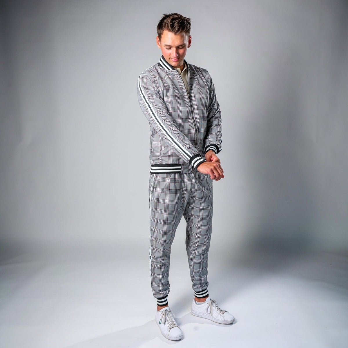 Man wearing grey check tracksuit with striped zip jacket and joggers | Chaps London