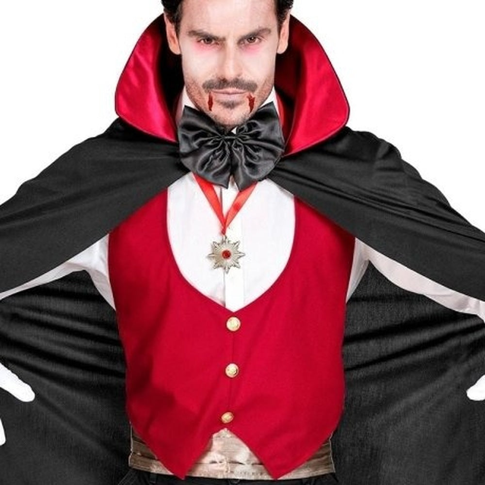 Man wearing black cape, red vest, black bow tie, and medallion | Chaps London