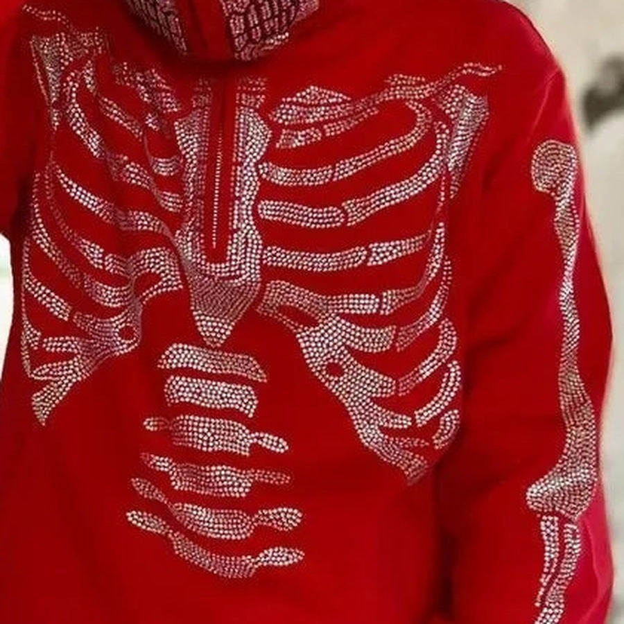 Red hoodie with rhinestone skeleton design, worn by a person, close-up view | Chaps London