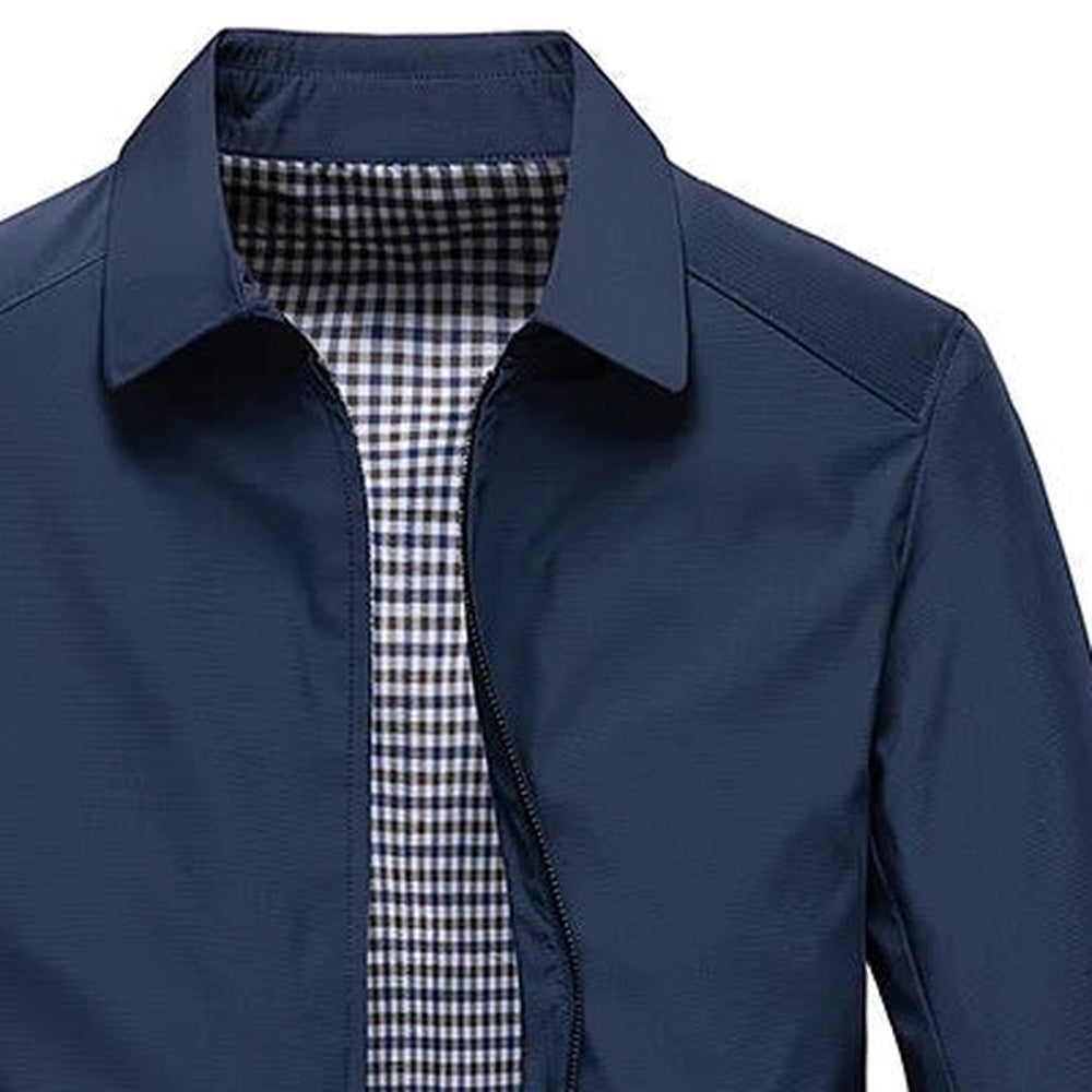 Navy blue zip-up jacket with shirt collar, plaid lining visible, worn by person | Chaps London