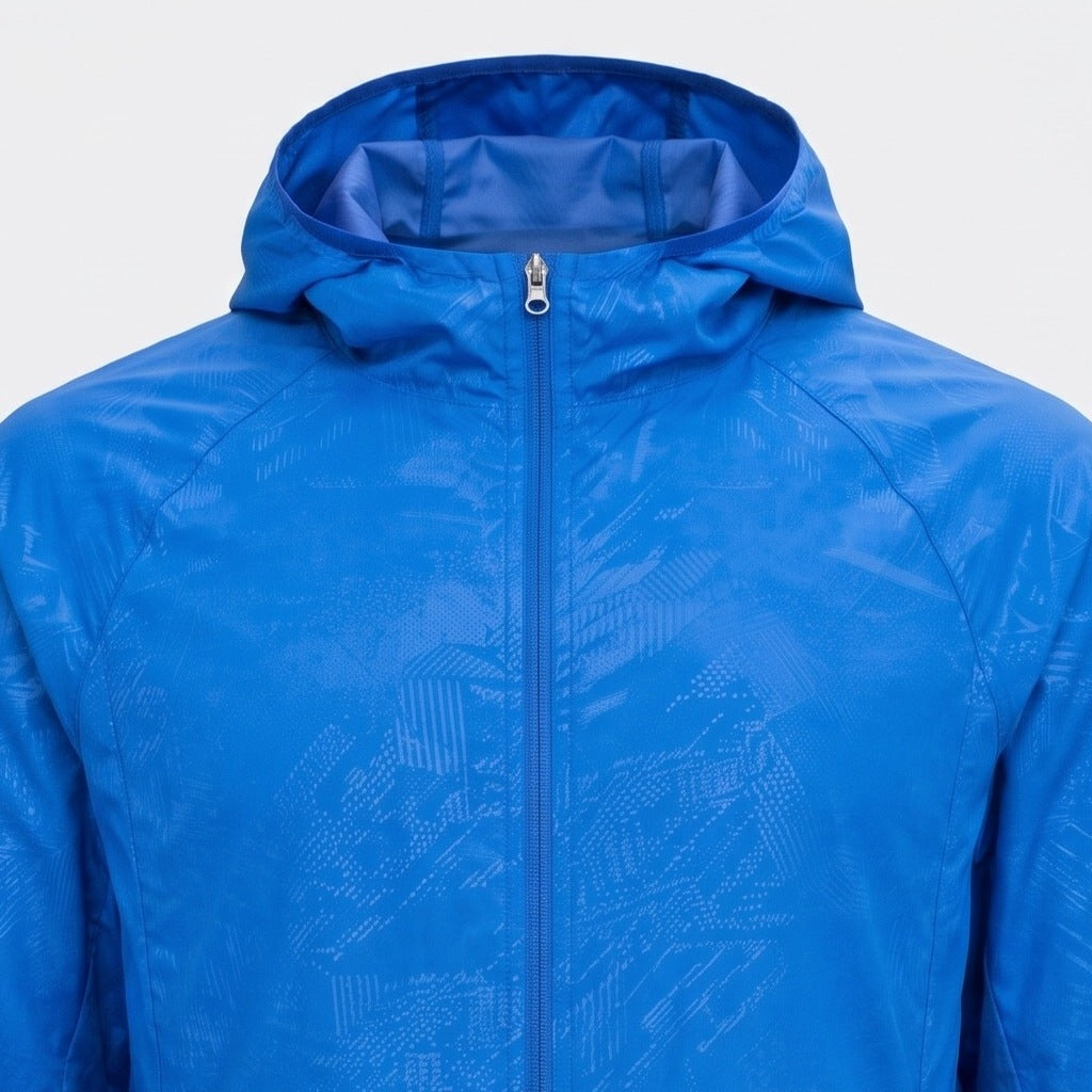Blue hooded windbreaker jacket with subtle geometric pattern, zipped, flat lay view | Chaps London