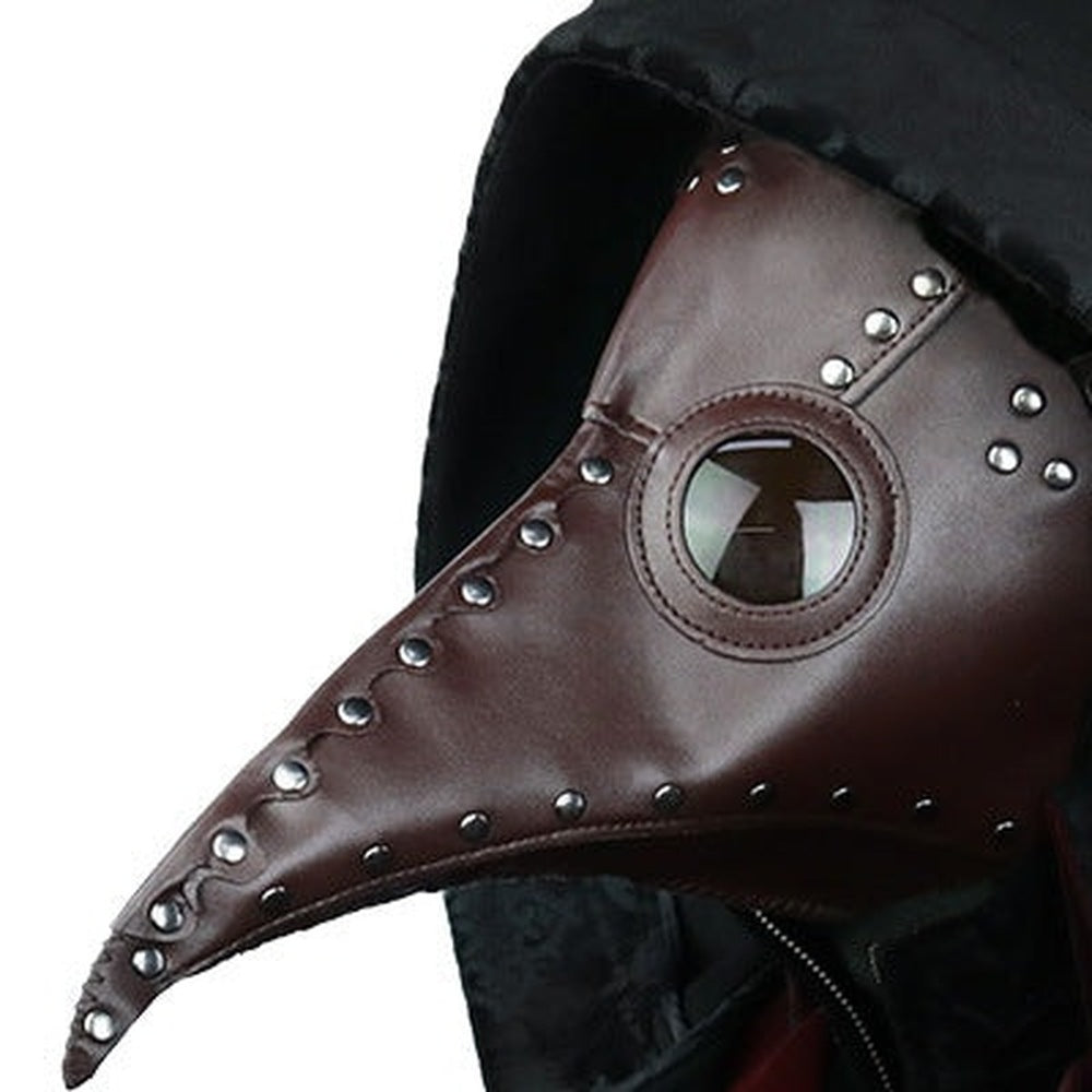 Brown faux leather plague doctor mask with rivets, worn by person | Chaps London