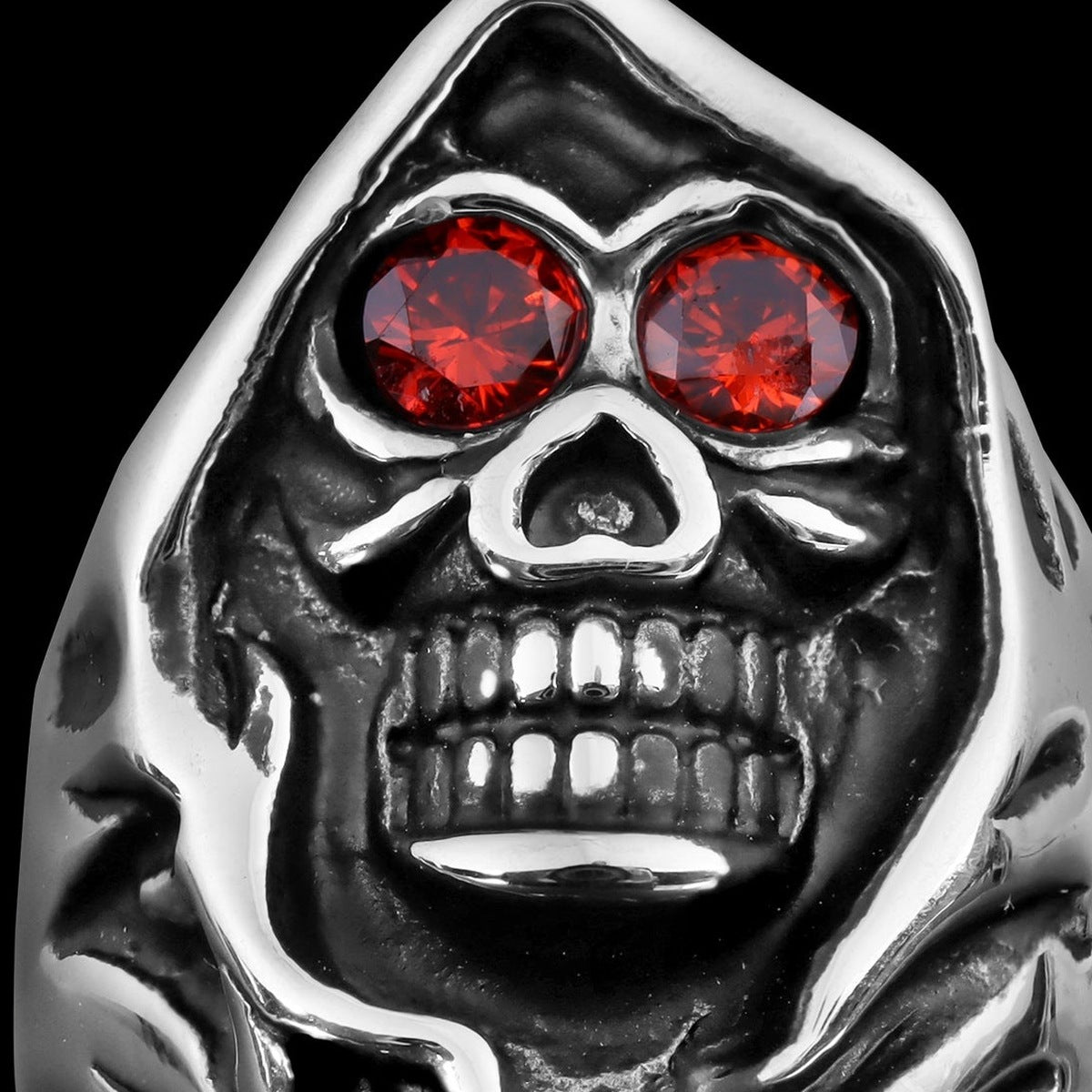 Silver hooded skull ring with red crystal eyes, close-up view | Chaps London