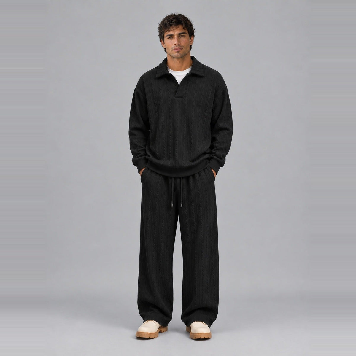 Man wearing black ribbed collared top and wide-leg trousers, full outfit | Chaps London