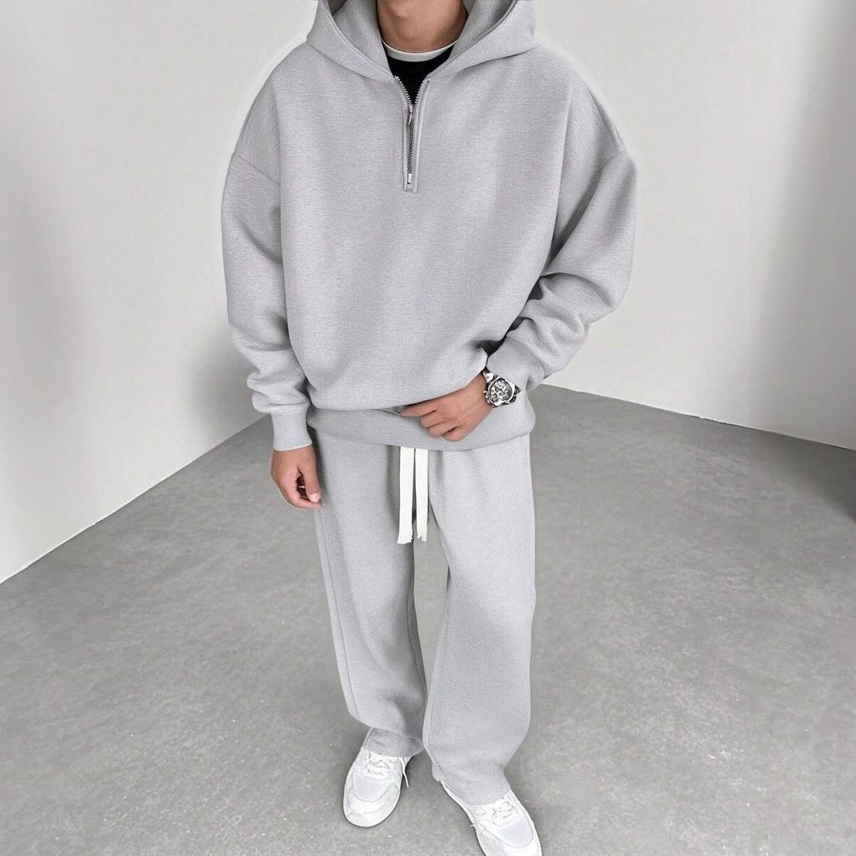 Man wearing grey half zip hoodie with matching wide leg joggers | Chaps London
