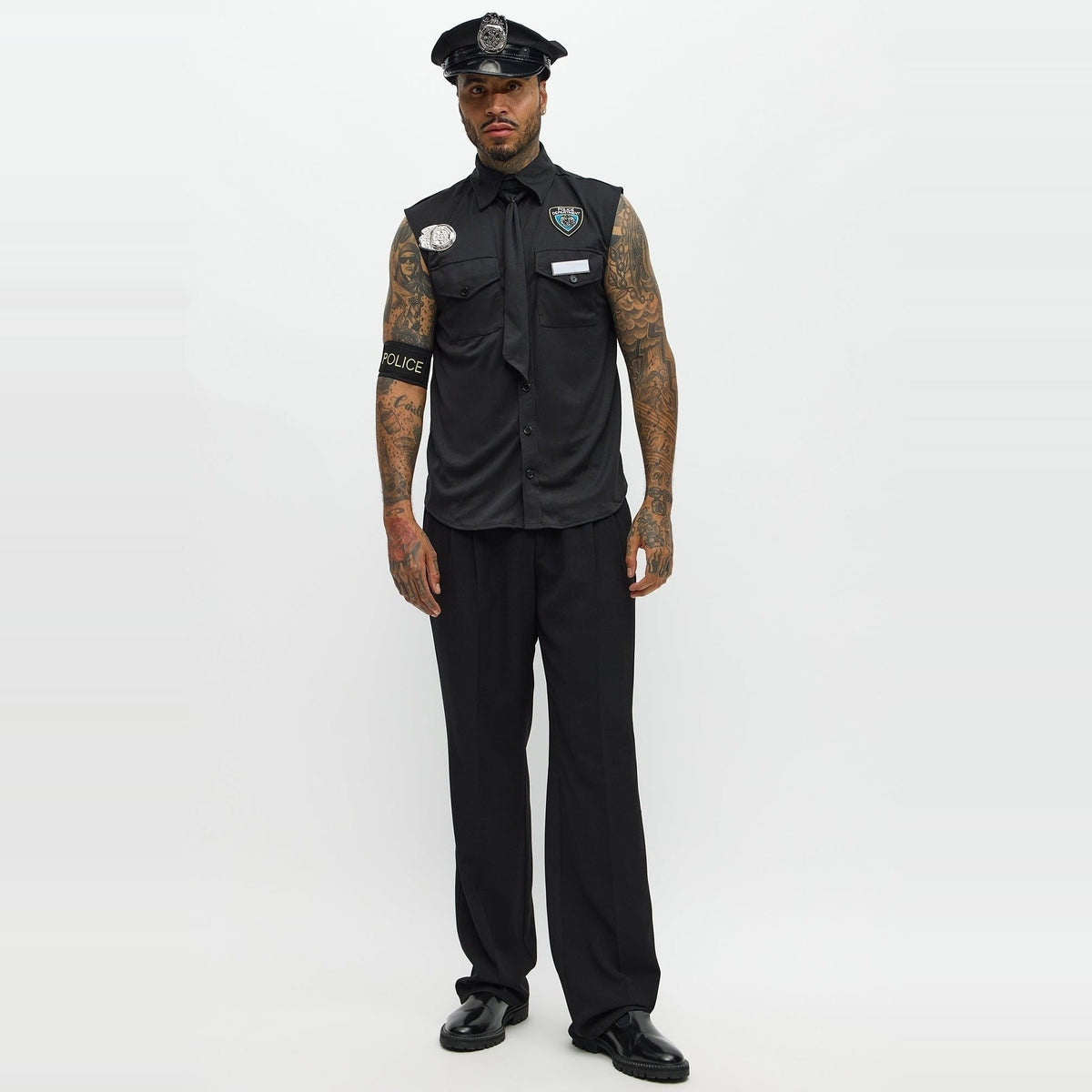 Man wearing black sleeveless police costume shirt, hat, and tie | Chaps London