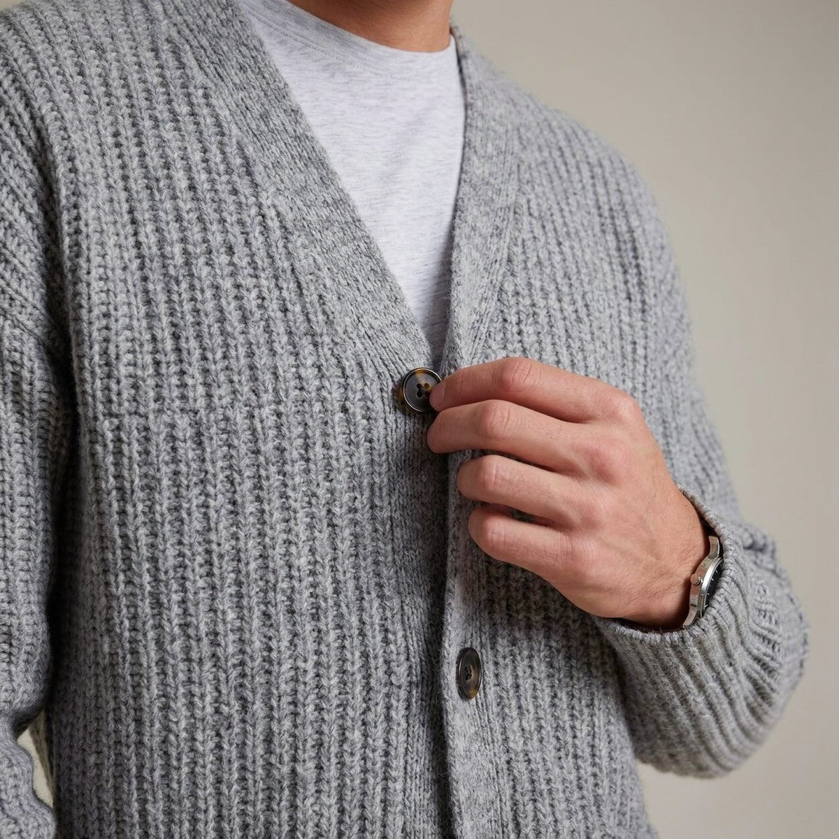 Gray ribbed knit cardigan worn by man, buttoning front, closeup view | Chaps London