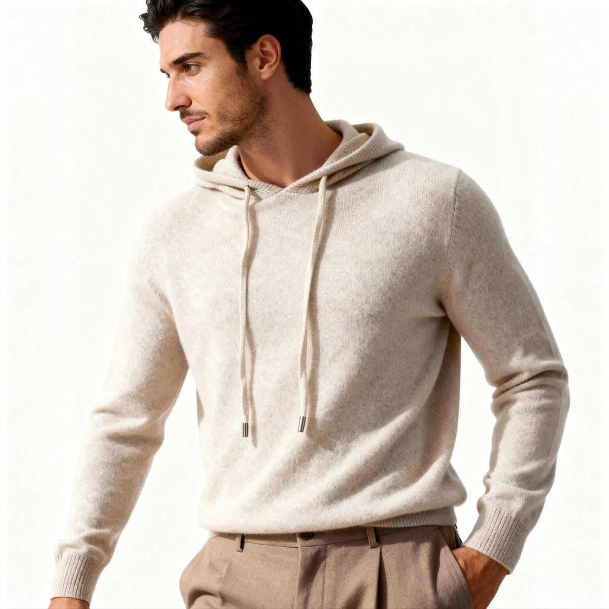 Man wearing beige knit hoodie with drawstring hood and tan trousers | Chaps London