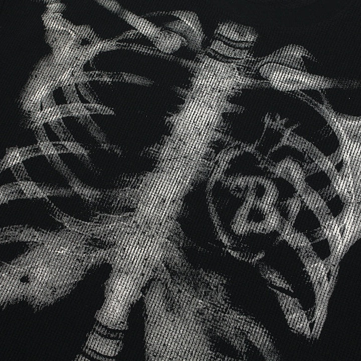 Close-up of black fabric with silver ribcage and spine print design | Chaps London