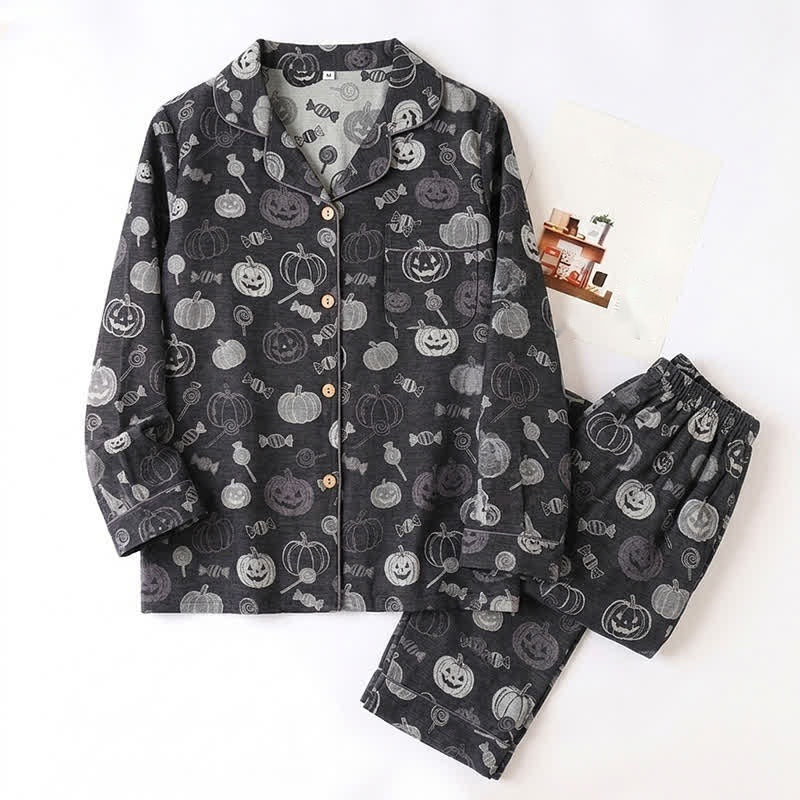 Black pajama set with pumpkin and candy print, shown flat | Chaps London