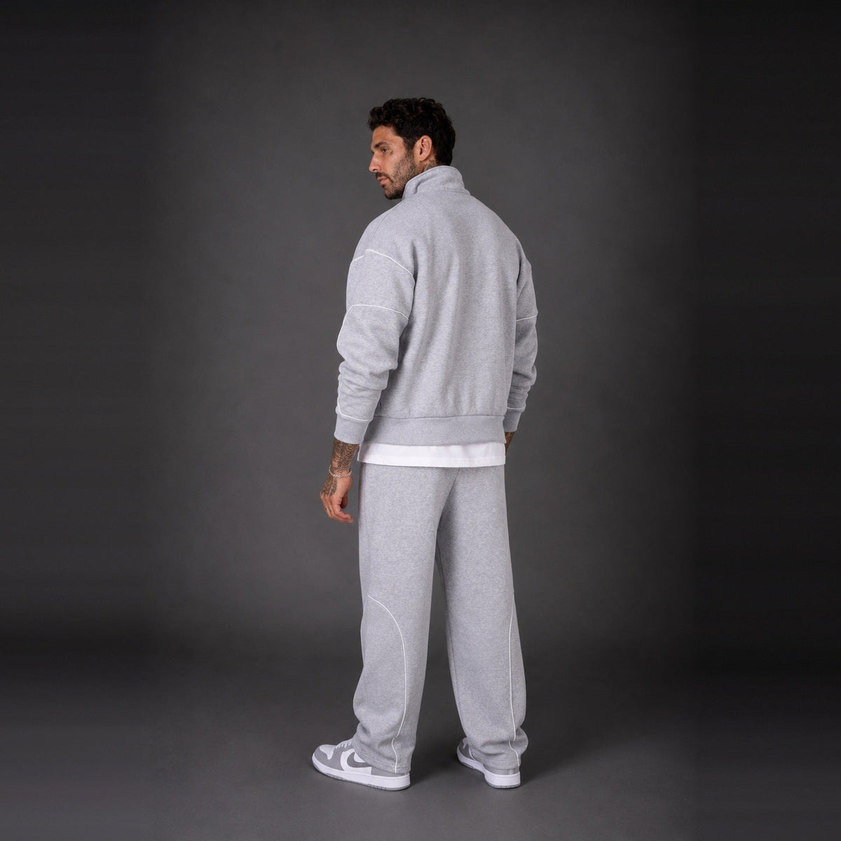 Man wearing light grey zip jacket and matching sweatpants, back view | Chaps London