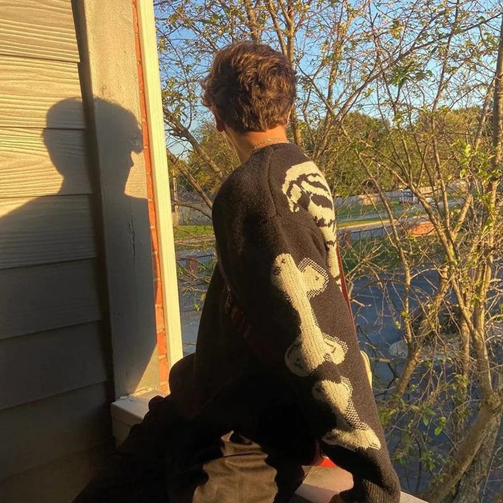 Black skeleton jumper worn by person, back view with bone sleeve design | Chaps London
