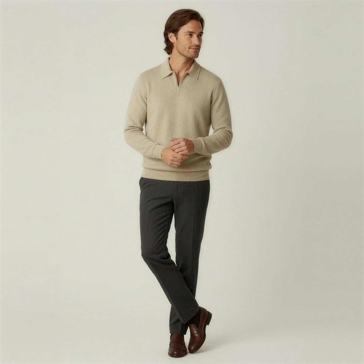 Man wearing beige knit quarter-zip polo sweater with dark trousers and brown shoes | Chaps London