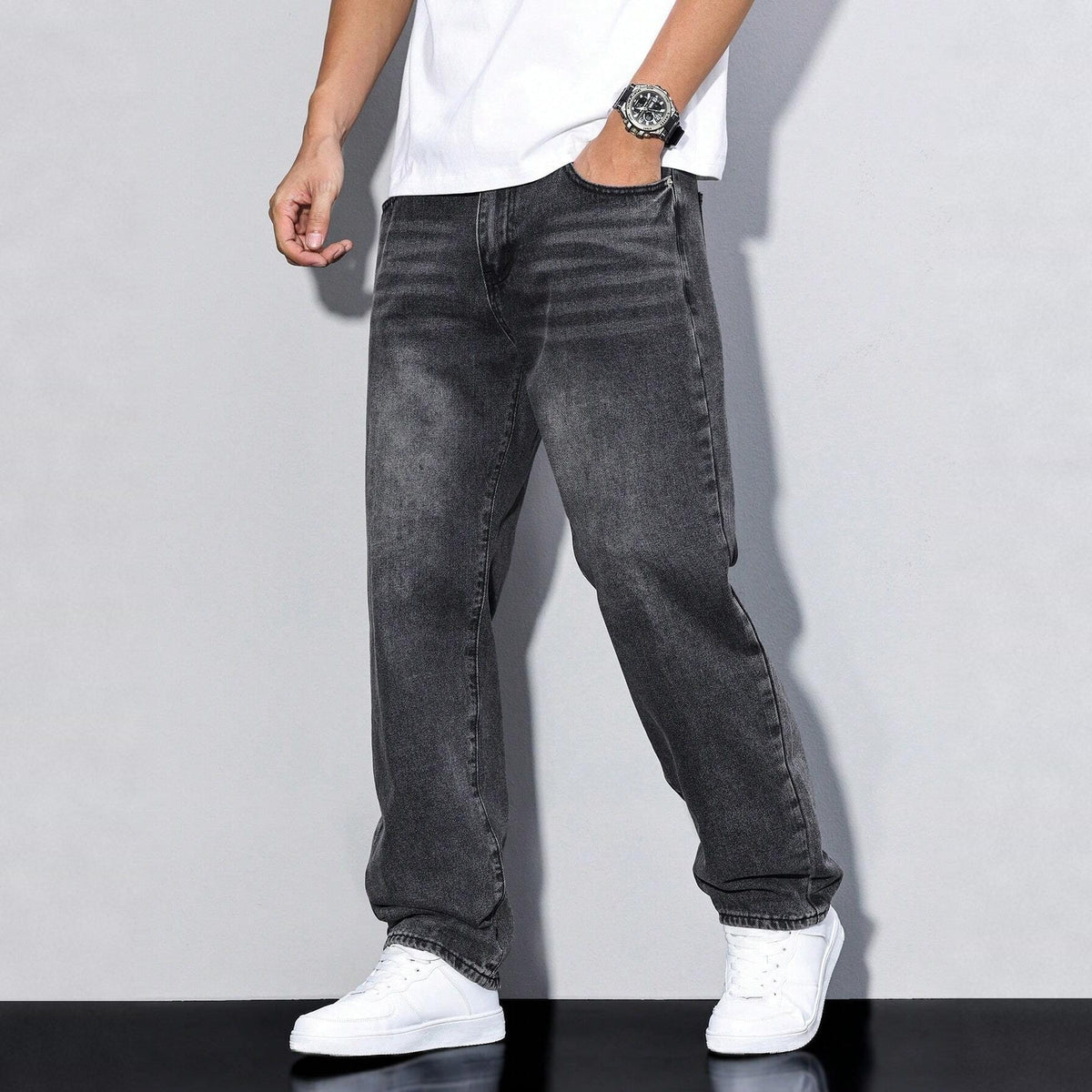 Man wearing gray washed wide-leg denim jeans with white sneakers and t-shirt | Chaps London