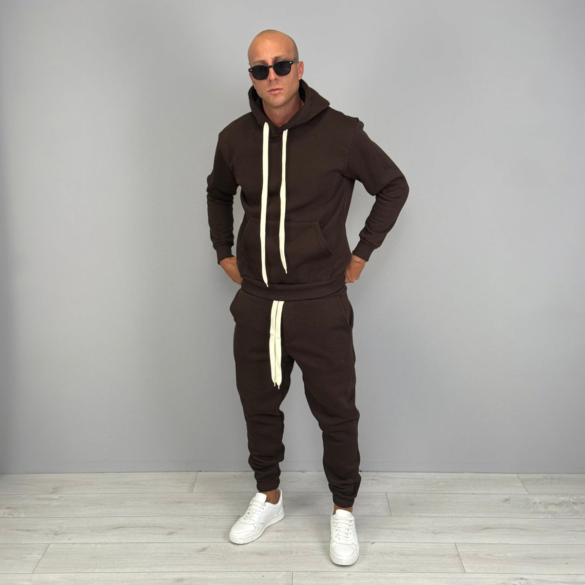 Man wearing brown hoodie and matching jogger tracksuit with sunglasses | Chaps London