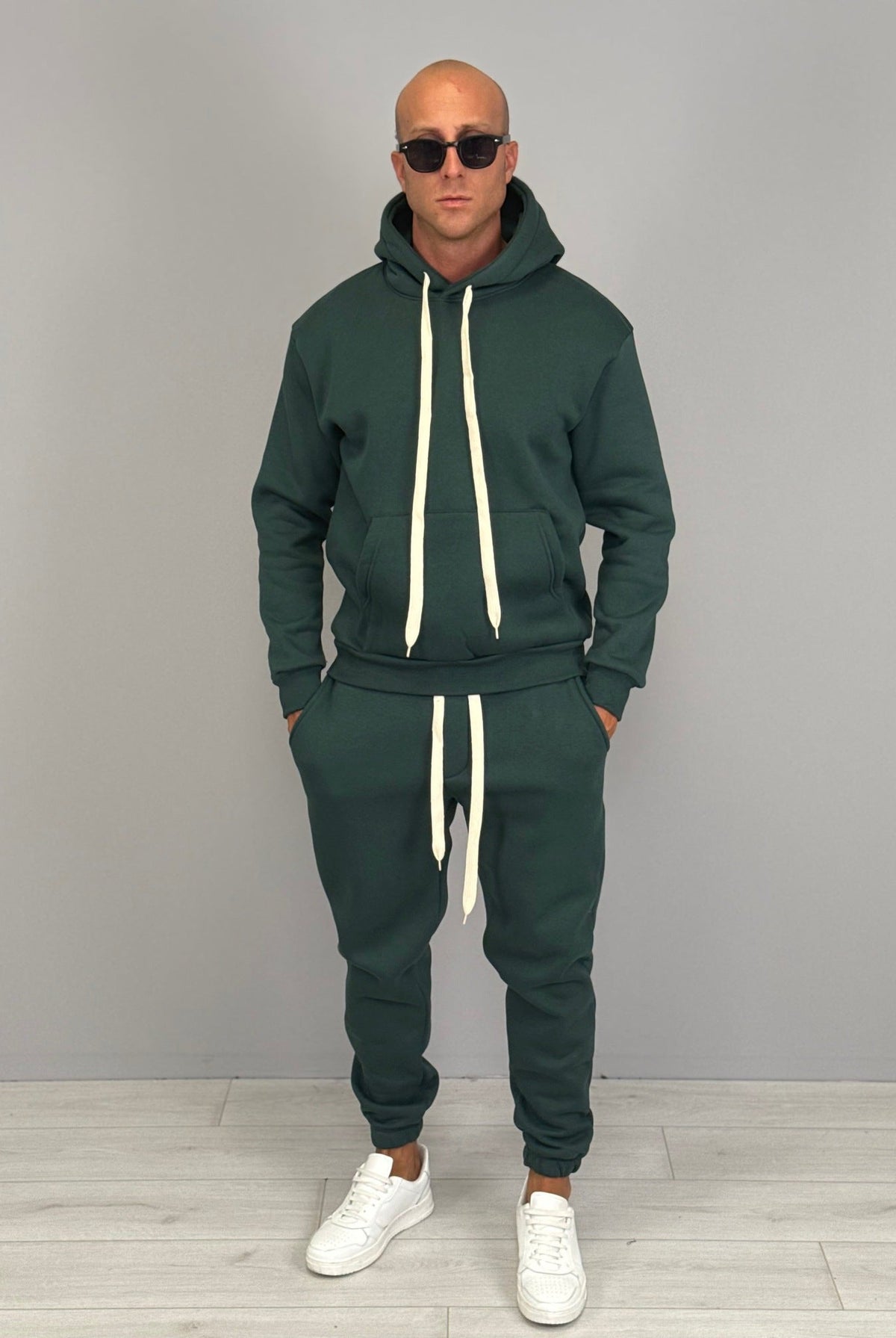 Man wearing dark green hoodie and matching jogger tracksuit outfit | Chaps London