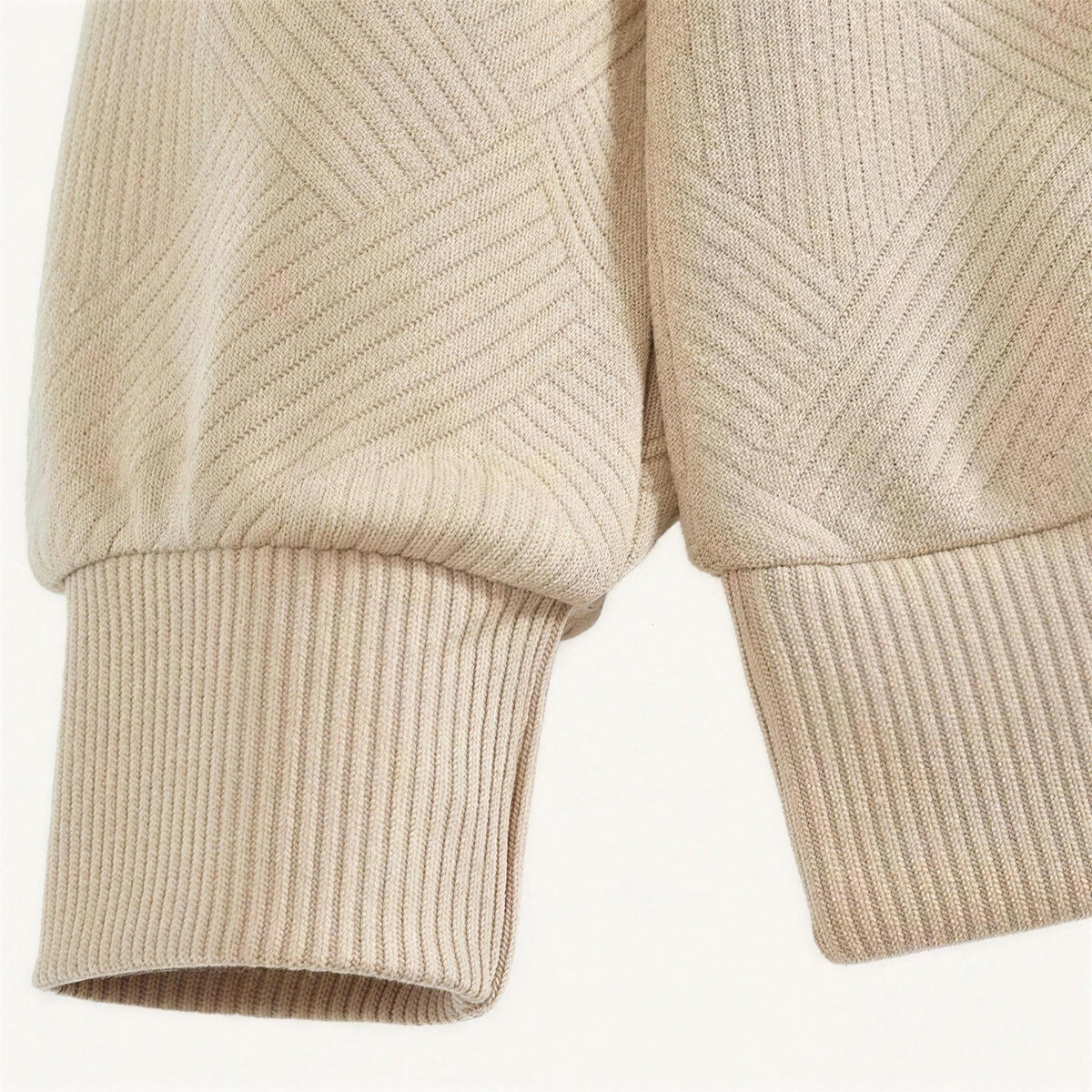 Beige textured knit sweater cuff and sleeve detail, close-up ribbed texture | Chaps London