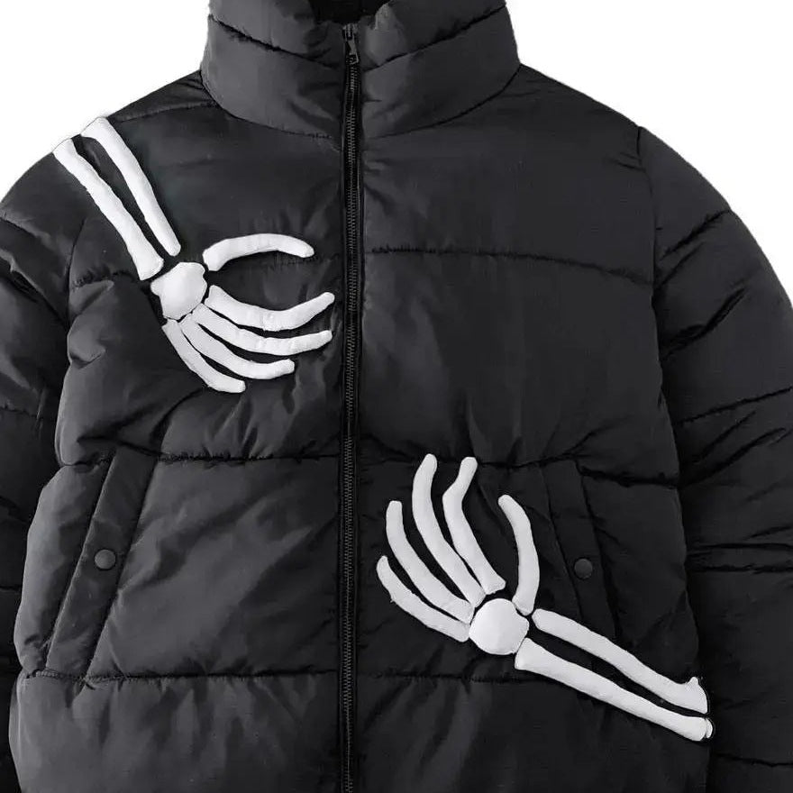 Black puffer jacket worn by person with skeleton hand graphic details | Chaps London